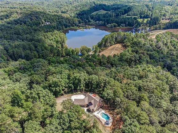 10.98 Acres of Land with Home for Sale in Marblehill, Georgia