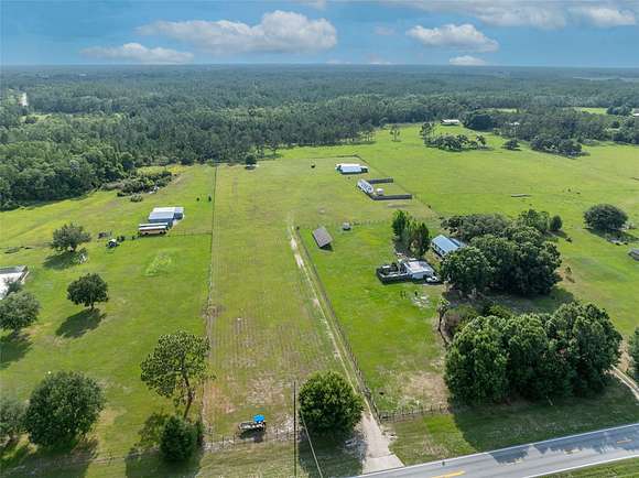 4.99 Acres of Residential Land with Home for Sale in Polk City, Florida