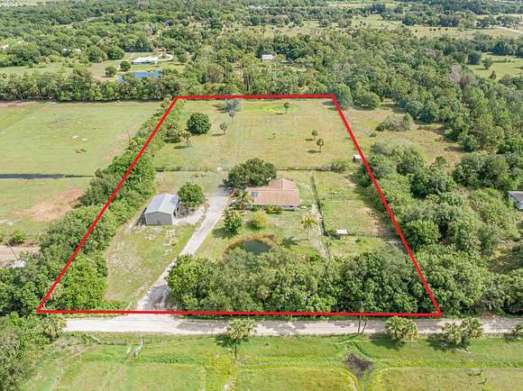5 Acres of Residential Land with Home for Sale in Fellsmere, Florida