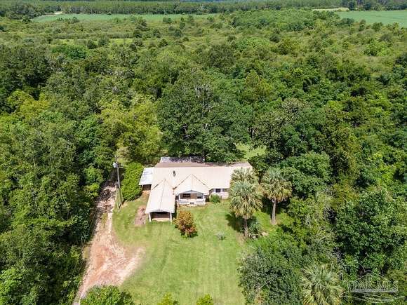 3.25 Acres of Residential Land with Home for Sale in Pace, Florida