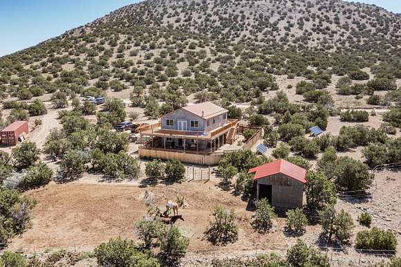 20 Acres of Land with Home for Sale in Madrid, New Mexico