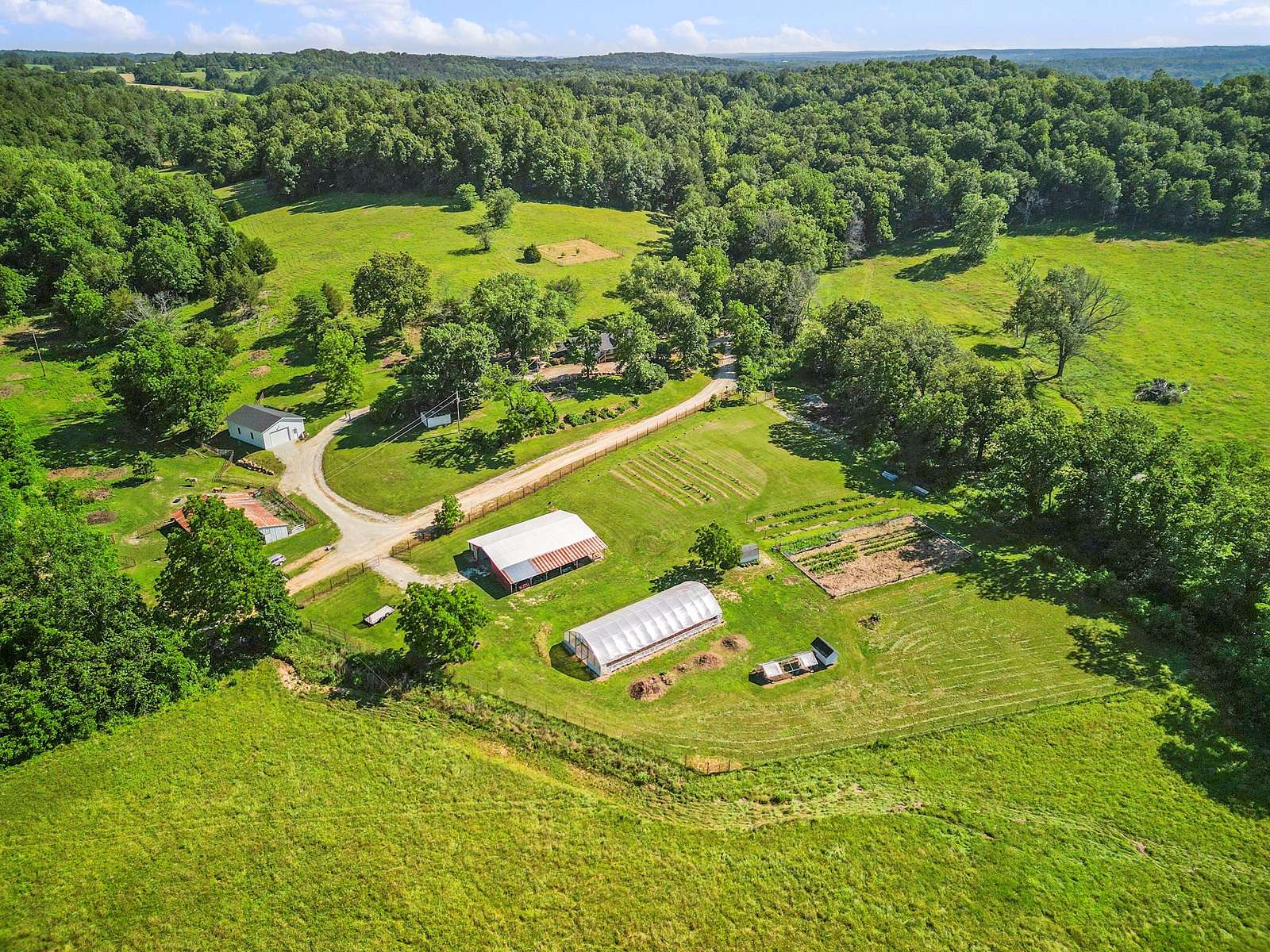 80 Acres of Land with Home for Sale in Vanzant, Missouri