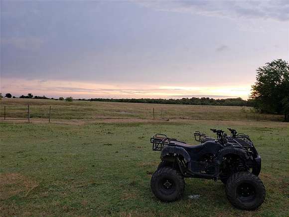 30.11 Acres of Agricultural Land with Home for Sale in Commerce, Texas