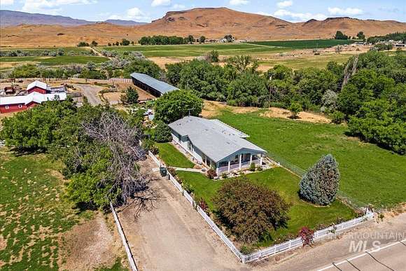 77.33 Acres of Agricultural Land with Home for Sale in Melba, Idaho
