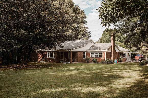 9 Acres of Residential Land with Home for Sale in Piggott, Arkansas