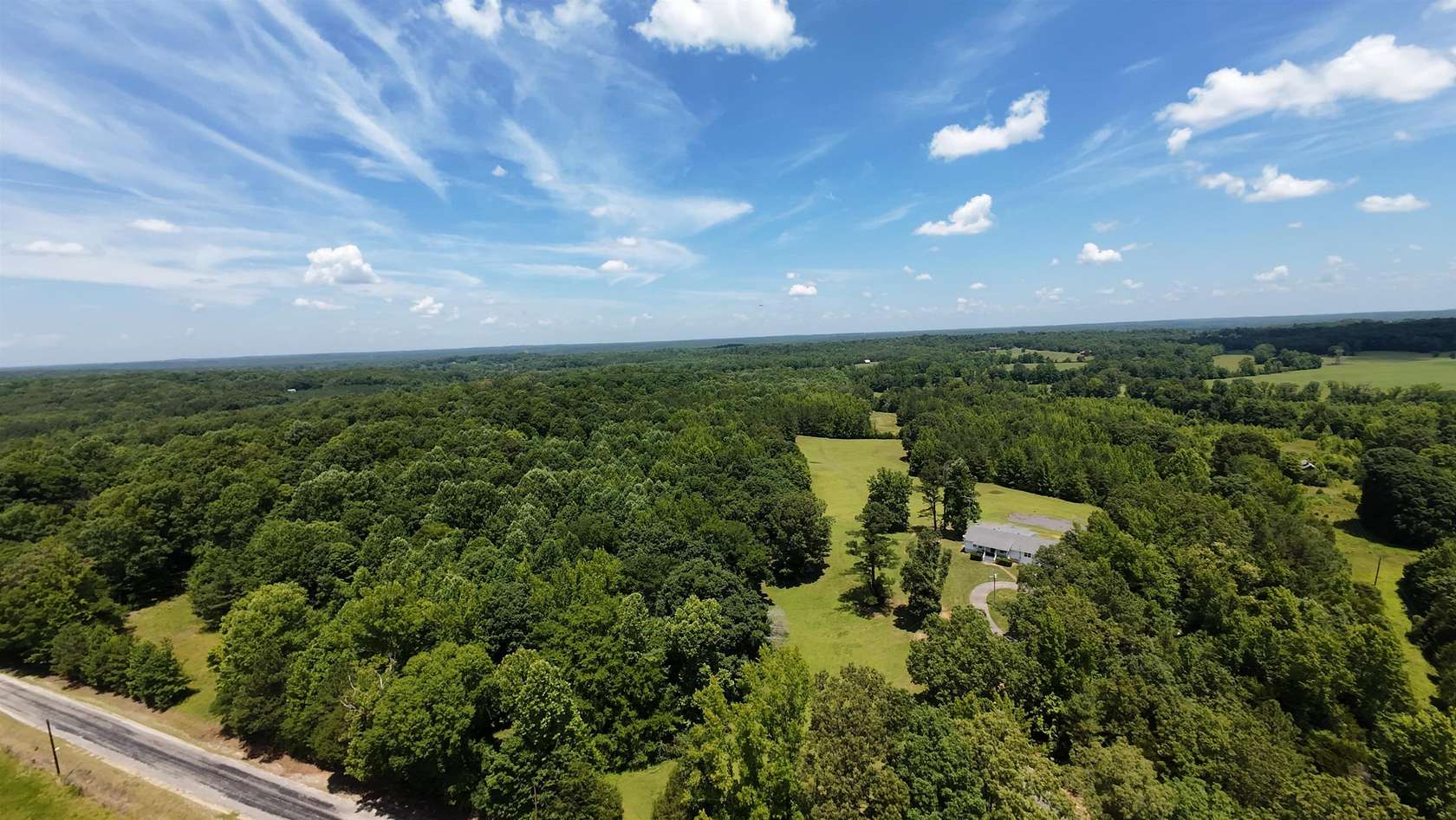 54.7 Acres of Land with Home for Sale in Beech Bluff, Tennessee