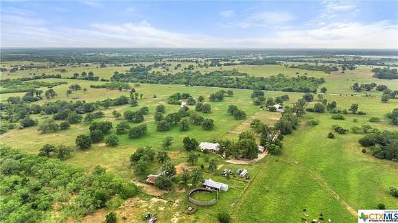27.474 Acres of Agricultural Land with Home for Sale in Luling, Texas