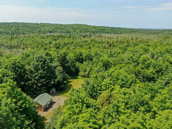71.4 Acres of Recreational Land with Home for Sale in Prentiss, Maine