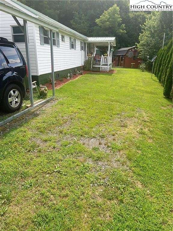 3.5 Acres of Residential Land with Home for Sale in Lansing, North Carolina