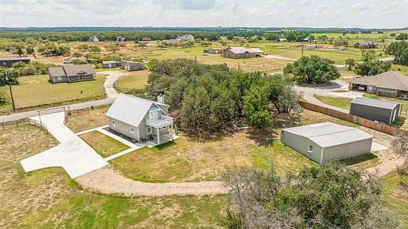 10 Acres of Residential Land with Home for Sale in Lipan, Texas