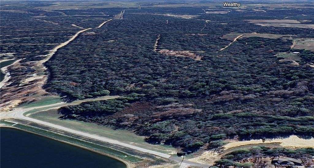 84.736 Acres of Recreational Land with Home for Sale in Hilltop Lakes, Texas