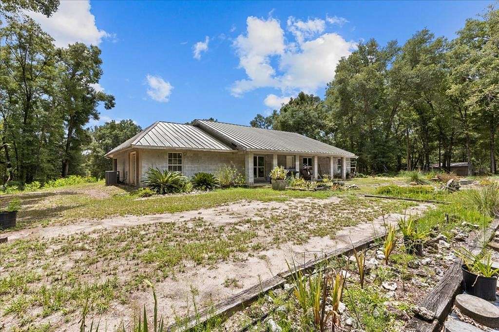 4.9 Acres of Residential Land with Home for Sale in Bell, Florida