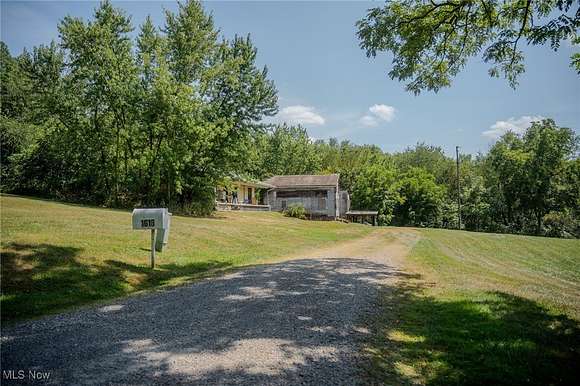 8 Acres of Residential Land with Home for Auction in Baltic, Ohio