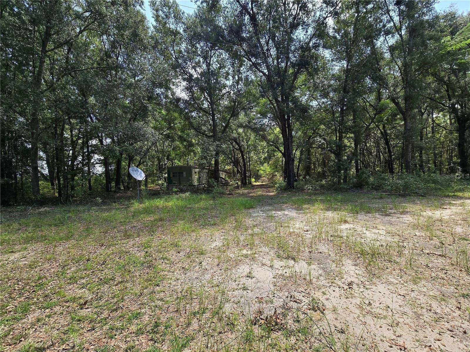 14.7 Acres of Land with Home for Sale in Newberry, Florida