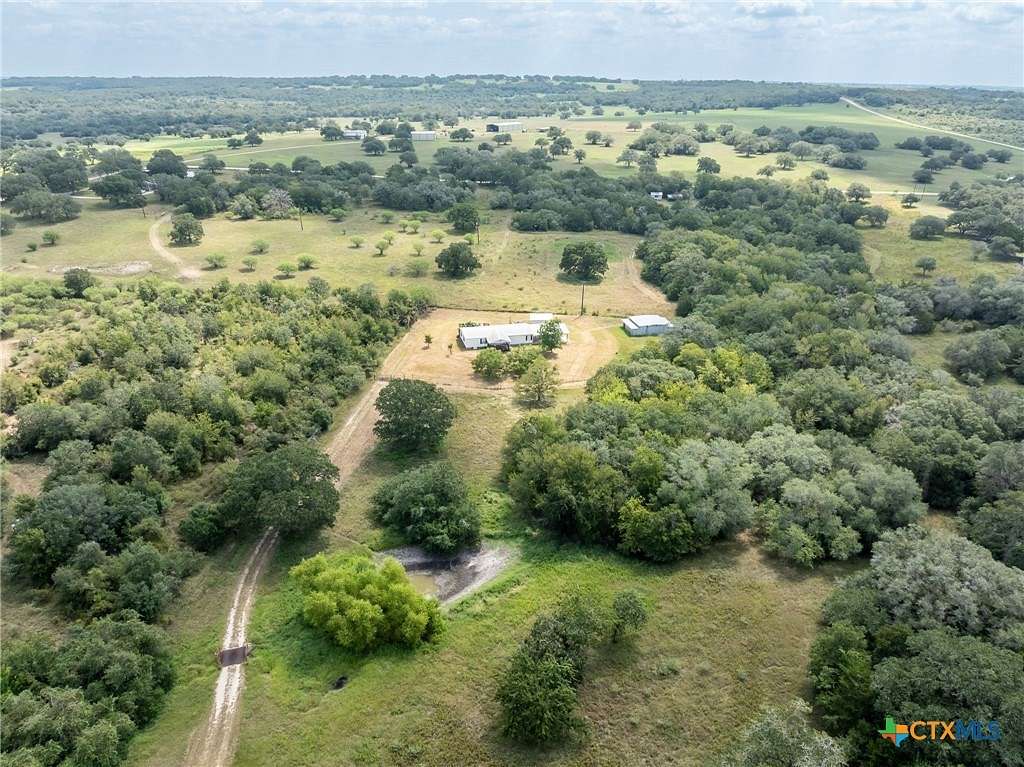 11.699 Acres of Land with Home for Sale in Gonzales, Texas