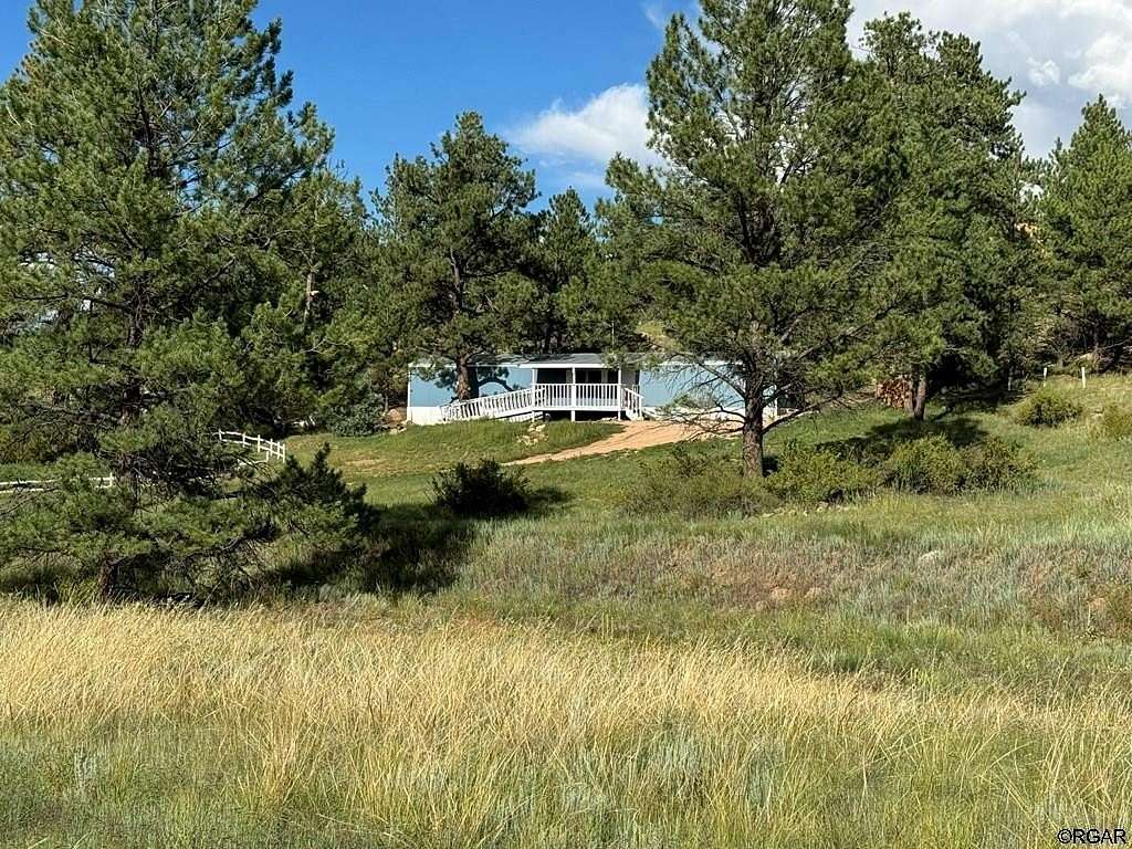 5 Acres of Residential Land with Home for Sale in Cotopaxi, Colorado