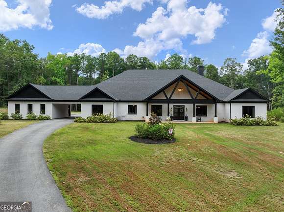 12.57 Acres of Land with Home for Sale in Loganville, Georgia