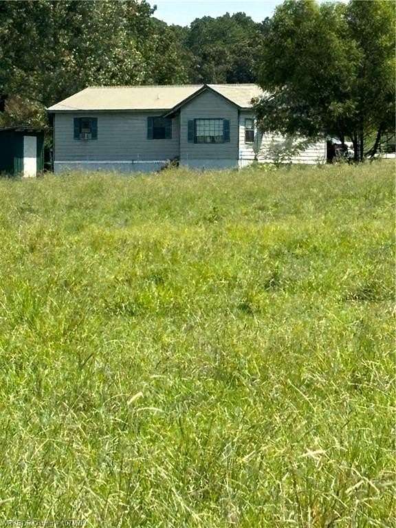 4.98 Acres of Residential Land with Home for Sale in Heavener, Oklahoma