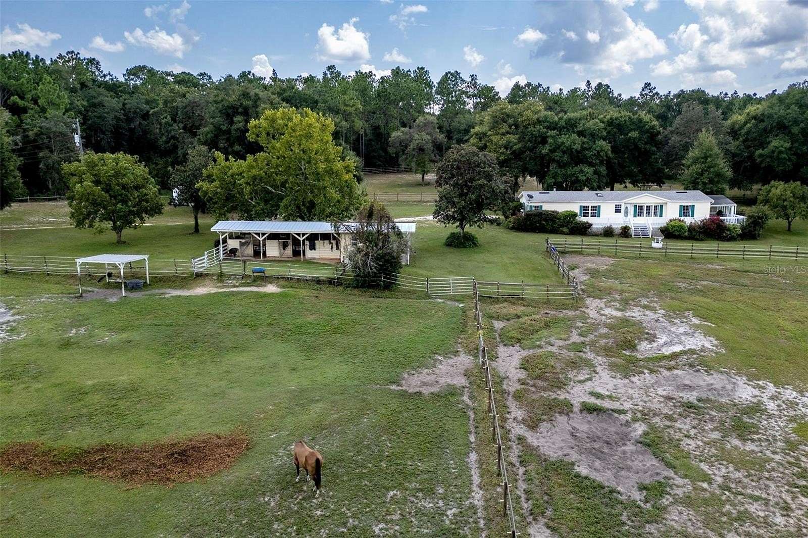 12.84 Acres of Land with Home for Sale in Lady Lake, Florida