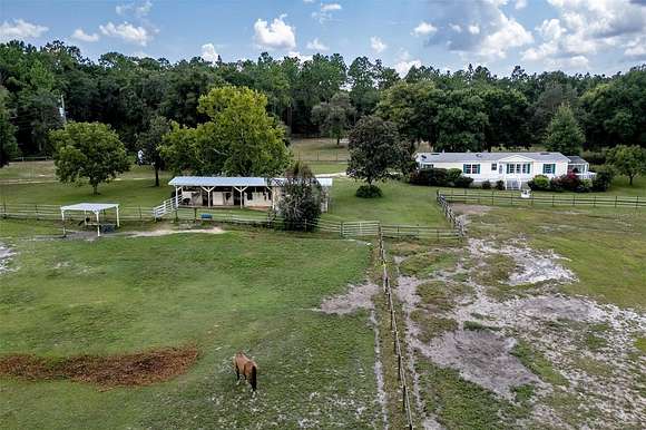 12.84 Acres of Land with Home for Sale in Lady Lake, Florida