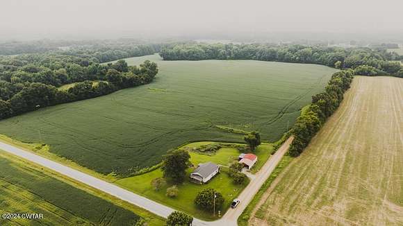 76.3 Acres of Land with Home for Auction in Humboldt, Tennessee