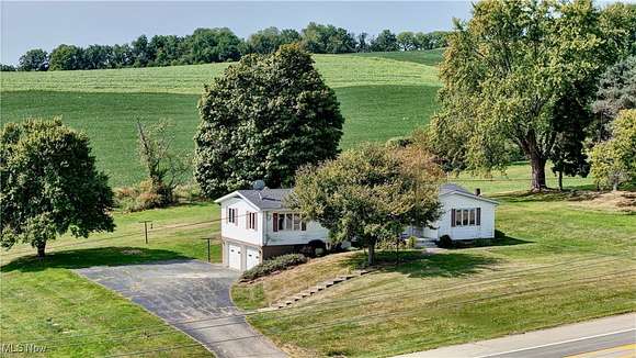 2.126 Acres of Residential Land with Home for Auction in Millersburg, Ohio