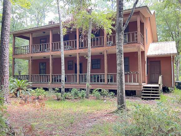 32.7 Acres of Recreational Land with Home for Sale in Kiln, Mississippi