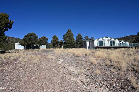 5.24 Acres of Residential Land with Home for Sale in Seligman, Arizona