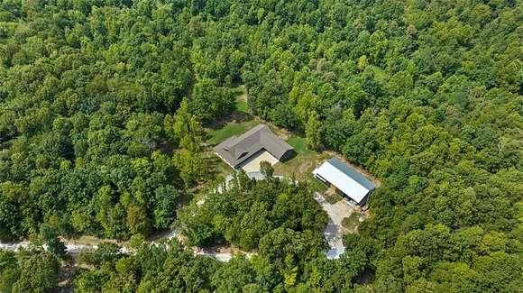 19.92 Acres of Land with Home for Sale in Gravette, Arkansas