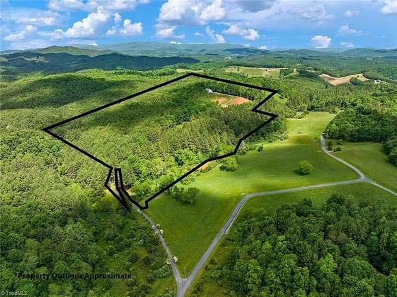 32.22 Acres of Land with Home for Sale in Crumpler, North Carolina