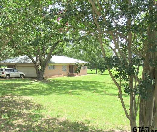 5.19 Acres of Residential Land with Home for Sale in Elkhart, Texas