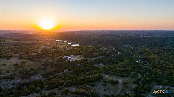 54 Acres of Agricultural Land with Home for Sale in Blanco, Texas