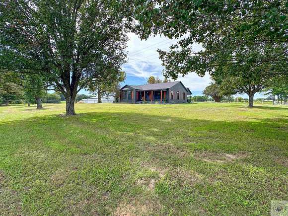 75.46 Acres of Land with Home for Sale in De Kalb, Texas