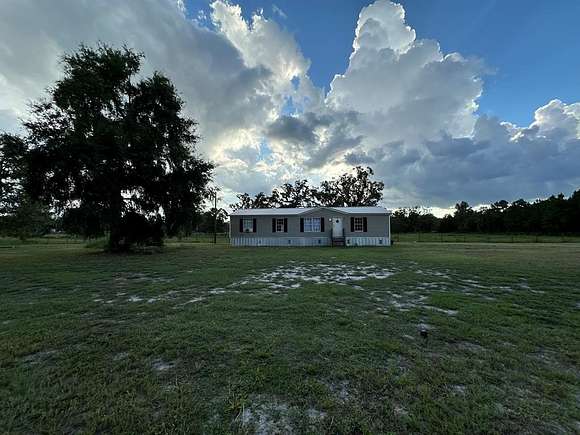 5 Acres of Residential Land with Home for Sale in Cross City, Florida