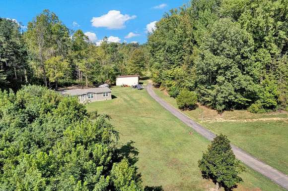 14.11 Acres of Land with Home for Sale in Drummonds, Tennessee