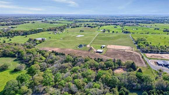 48.703 Acres of Agricultural Land with Home for Sale in Ravenna, Texas