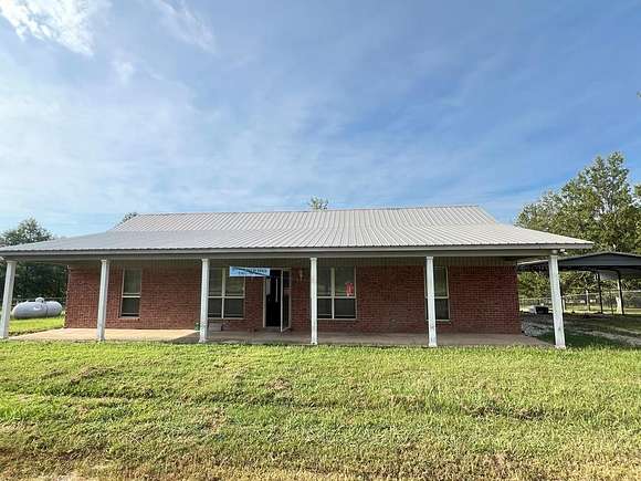 3.2 Acres of Residential Land with Home for Sale in Gore Springs, Mississippi