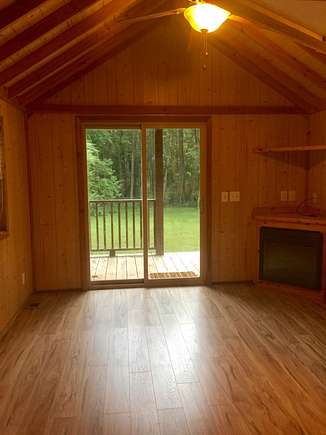 New laminate wood floors with electric fireplace & entertainment center