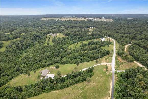 10.69 Acres of Land with Home for Sale in Gravette, Arkansas