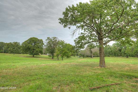 19 Acres of Land with Home for Sale in Carthage, Missouri