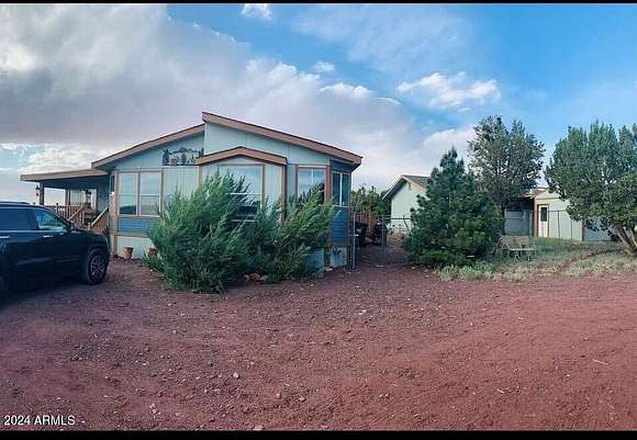 2.41 Acres of Residential Land with Home for Sale in Show Low, Arizona