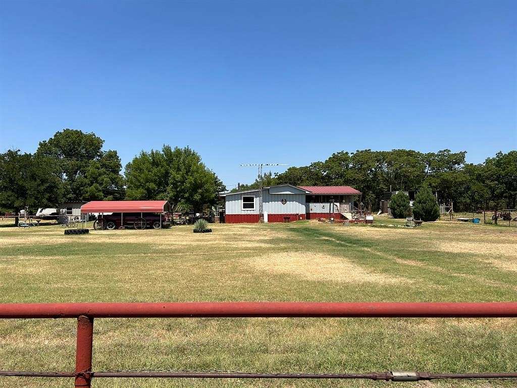 9.9 Acres of Residential Land with Home for Sale in Iowa Park, Texas