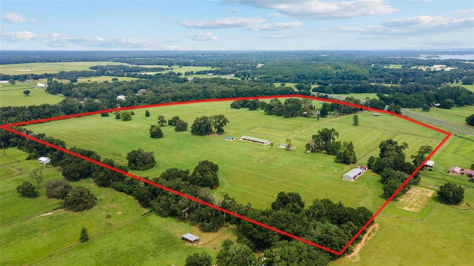 89.22 Acres of Agricultural Land with Home for Sale in Reddick, Florida