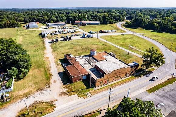 13.9 Acres of Improved Mixed-Use Land for Sale in Gravette, Arkansas