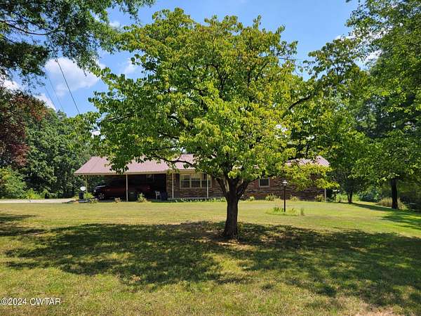 8.3 Acres of Residential Land with Home for Sale in Huntingdon, Tennessee