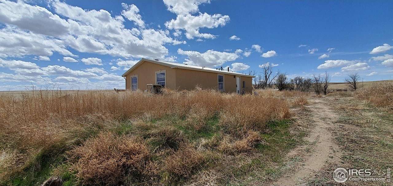 36.61 Acres of Agricultural Land with Home for Sale in Fort Morgan, Colorado