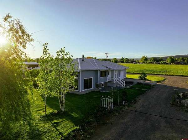21.8 Acres of Agricultural Land with Home for Sale in Hotchkiss, Colorado
