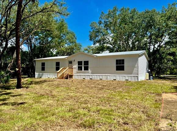 2.5 Acres of Residential Land with Home for Sale in Okeechobee, Florida