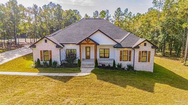 5.27 Acres of Residential Land with Home for Sale in Pace, Florida