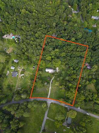 4.5 Acres of Residential Land with Home for Sale in McDonald, Tennessee